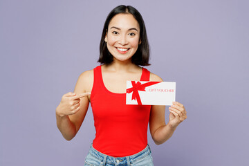 Young woman of Asian ethnicity she wears casual clothes red tank shirt hold point finger on gift...