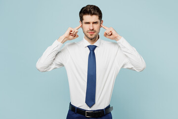 Young employee business man corporate lawyer wearing classic formal shirt tie work in office cover ears with hands fingers do not want to listen scream isolated on plain pastel blue background studio.