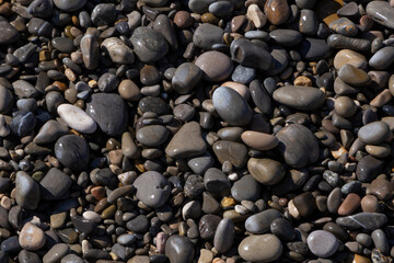 view on wet pebblestones on beach