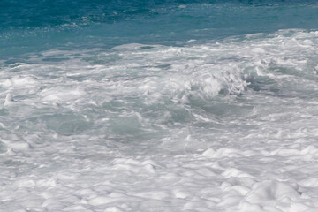 view on foamy waves on beach in Nice