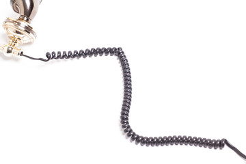 Black spiral telephone cord isolated on white background