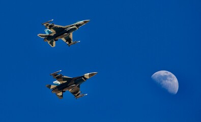 USAF  F16s, Falcons, Nellis AFB, with moon.