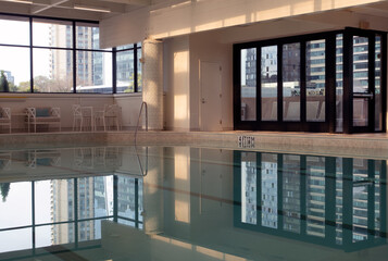 Reflection in still water in indoor pool in a luxury hotel