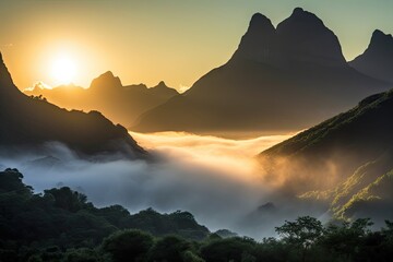 magnificent mountain range shrouded in mist, with the sun setting behind, created with generative ai