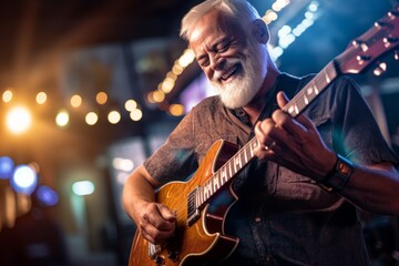 Close-up portrait photography of a grinning mature man playing the guitar against a lively night...