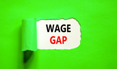 Wage gap symbol. Concept words Wage gap on beautiful white paper on a beautiful green background. Business, support and wage gap concept. Copy space.