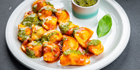 ravioli pesto sauce tomato sauce healthy meal food snack on the table copy space food background rustic top view