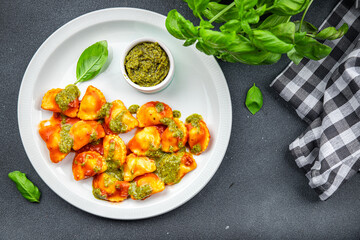 ravioli pesto sauce tomato sauce healthy meal food snack on the table copy space food background rustic top view
