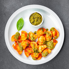 ravioli pesto sauce tomato sauce healthy meal food snack on the table copy space food background rustic top view