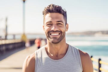 Fototapeta premium Close-up portrait photography of a happy boy in his 30s practicing yoga against a scenic beach pier background. With generative AI technology
