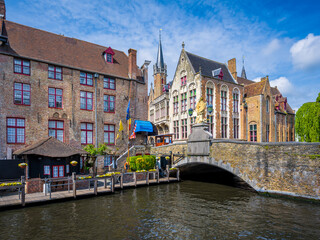 Fototapeta na wymiar Historic buildings along a canal in Bruges, Belgium