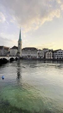 Vertical video of the old town of Zurich on the banks of the Limago river in Switzerland.