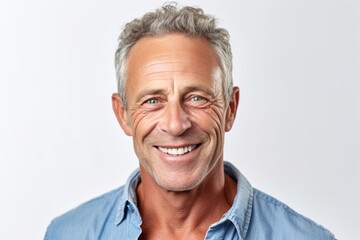 Obraz premium Medium shot portrait photography of a grinning mature man wearing a casual short-sleeve shirt against a white background. With generative AI technology