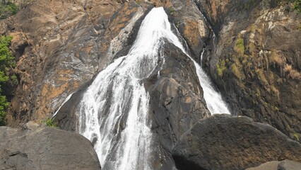 High waterfall cascade in mountain big rocks