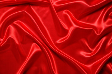 Obraz premium Abstract background made of red silk wavy fabric.