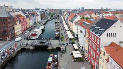 Aerial view  on NYhavn harbor with people walking and cars and  outdoor  cafes in famous place