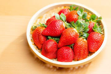 Fresh ripe strawberry in wooden basket