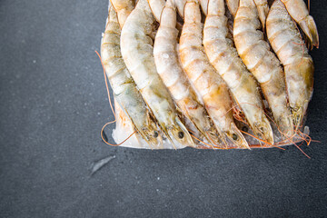 frozen shrimp raw gambas seafood prawn meal food snack on the table copy space food background rustic top view 