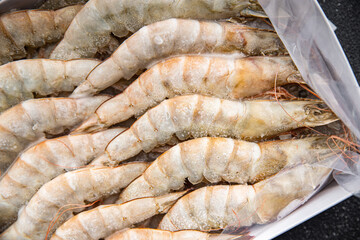 frozen shrimp raw gambas seafood prawn meal food snack on the table copy space food background rustic top view 