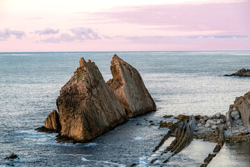 Steep islet in rocky coastline
