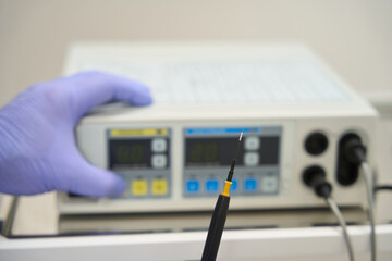 Close-up of radio wave knife apparatus for removing moles