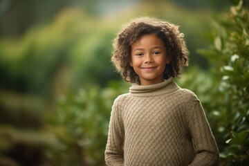 Fototapeta premium Environmental portrait photography of a grinning kid female wearing a cozy sweater against a serene tea garden background. With generative AI technology