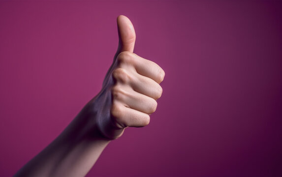 Hand with thumb up on magenta isolated background.Close up view.Copy and text space.Created with generative ai