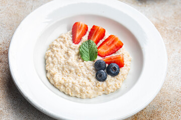 fresh oatmeal breakfast porridge berries healthy meal food snack on the table copy space food background rustic top view