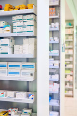 Pharmacy, shelf and boxes for healthcare, empty or pharmaceutical stock for wellness, health and interior. Shop, store and retail product with storage, choice or sale for medicine, discount and drugs
