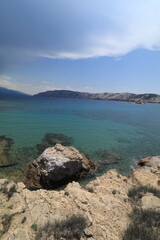 Stony wild Kastelina beach on the island of Rab in Croatia