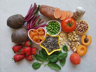 Iron rich food. Healthy food to eat in anemia. Assortment of fruits and vegetables to prevent or...
