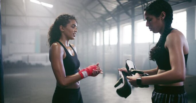 Boxer, smile or happy woman with coach in gym for exercise after training, workout or winning together. Teamwork, women or healthy girl athlete shaking hands with a female fitness or personal trainer