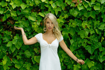 portrait of a woman with green background of leaves