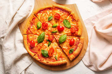 Board with tasty pizza margarita on white background
