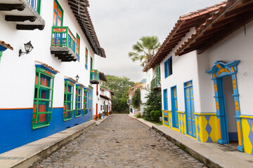 village in the mountains of colombia with traditional colonial houses of different colors, village with spanish roots