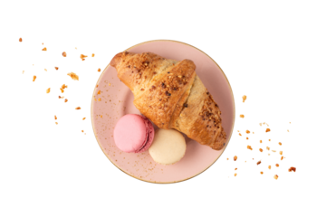 Fresh baked nut croissant and french cookies macarons macaroons with crumbs on vintage pink plate isolated on white background.