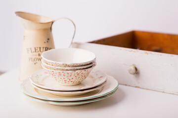 Closeup of porcelain plates and bowls