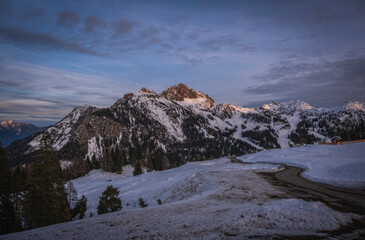 Fototapeta na wymiar Alpenglow at sunset time on mountain peak at Nassfeld ski resort, Carinthia, Austria. January 2022