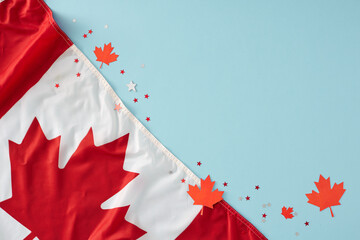 Idea for patriotic celebrations on Canada Day. Top view photo of national flag, red maple leaves,...