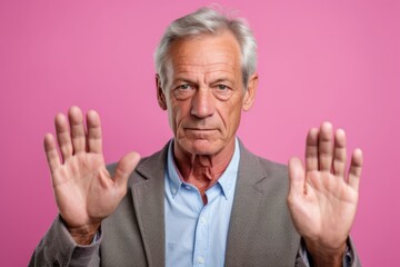 Medium shot portrait photography of a glad mature man making a sorry gesture with hands together against a pastel or soft colors background. With generative AI technology