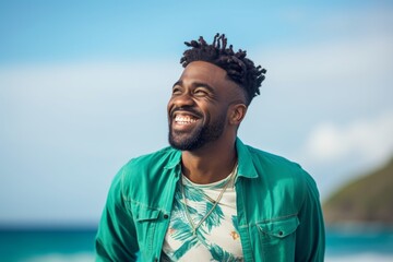 Close-up portrait photography of a joyful boy in his 30s crossing the arms against a sea-green background. With generative AI technology