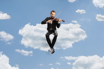 Violinist sitting on a cloud and playing a violin