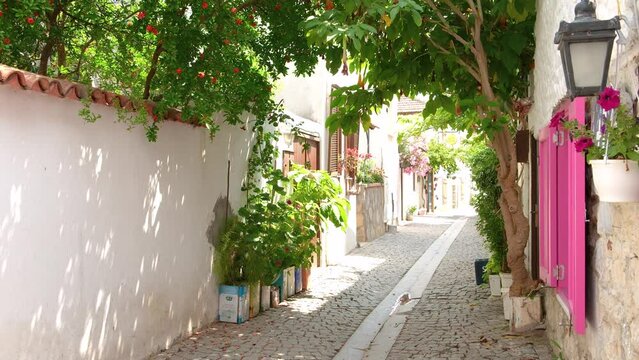 Footage of narrow street, traditional, old historical houses in famous, touristic Aegean town called "Sigacik". It is a village of Seferihisar district of Izmir, cittaslow, slow city