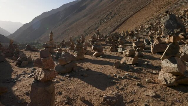 view of the Elqui Valley from a viewpoint in Cochiguaz between stone piles or cairn
