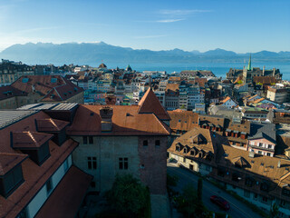 August 22nd 2022, Lausanne, Switzerland. A drone aerial shot of Lausanne city centre, History Museum, and Old Bishop’s Palace at sunrise.