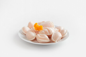 Traditional portuguese egg yolk sweets Ovos Moles de Aveiro on white background. Confectionery shop
