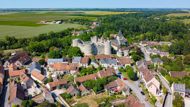 Aerial view of the medieval castle of Yèvre le Châtel in the French department of Loiret - Enclosure with 4 round towers at the top of a hill in a rural village