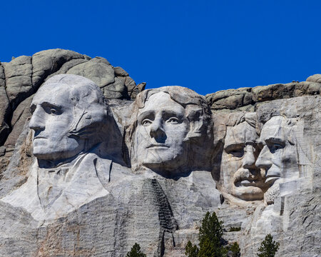 Picture of Mount Rushmore taken from a road side pull out.
