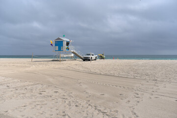 February, 15, 2023, Miami Beach, Florida, USA: deserted sand beach under clouds during winter