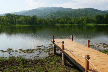 Wood bridge on the lake in Chiang-Mai, Thailand.   